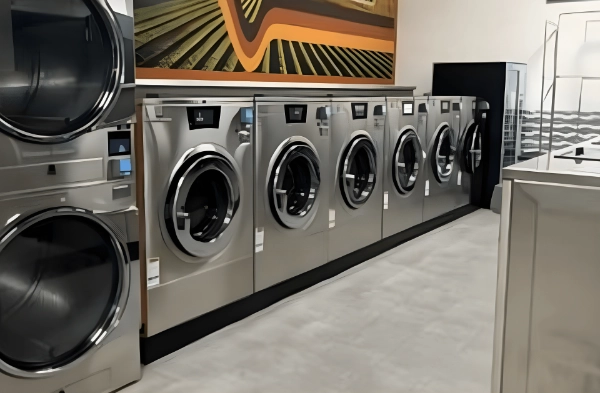 washing machines under a mural